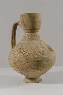 Islamic Seljuk Terracotta Jug c.10th-12th century AD. Size 9 1/4 inches high. Fine unglazed terracotta Jug decorated with raised ornate design. strap 
