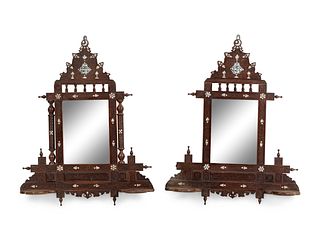 A Pair of Syrian Mother-of-Pearl Inlaid Walnut Lantern Shelves
Height 29 1/2 x width 23 inches.