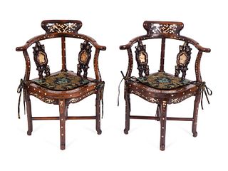 A Pair of Asian Mother-of-Pearl Inlaid Rosewood Corner Chairs
Height 33 x width 27 x depth 21 1/2 inches.