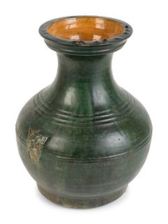 A Chinese Green-Glazed Terracotta Hu-Form Vase
Height 14 x diameter 10 1/2 inches.