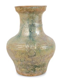 A Chinese Light Green-Glazed Terracotta Hu-Form Vase
Height 13 inches.
