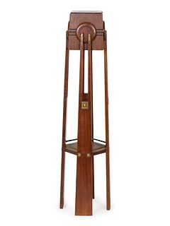 An Art Deco Gilt-Metal-Mounted Mahogany Pedestal
Height 48 1/4 x top, 7 1/8 x 6 7/8 inches.