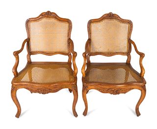A Pair of Louis XV Style Carved Walnut Fauteuils
Height 38 3/4 inches.