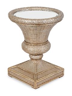 A Neoclassical Style Silvered Rattan and Glass Center Table
Height 29 inches; diameter of glass top 60 inches. 