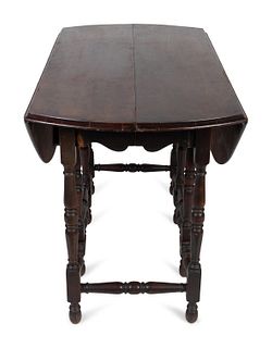 A William & Mary Style Mahogany Gateleg Table
Height 30 1/2 x length 47 1/2 inches.