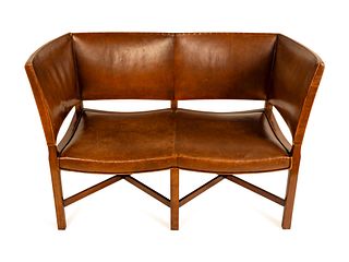 An Unusual George III Style Leather-Upholstered Settee
Height 37 x length 57 x depth 21 inches.