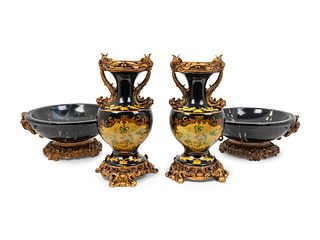 A Pair of Simulated Marble Vases and a Matching Pair of Bowls
Height of vases 16 x width 8 inches; height of bowls 6 1/2 x diameter 14 1/2 inches.