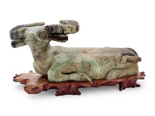 A Chinese Export Carved Hardstone Model of a Bull
Height of bull 7 3/8 x length 20 x depth 10 1/4 inches.