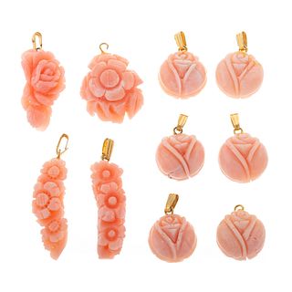 A Collection of Carved Angel Skin Coral Pendants