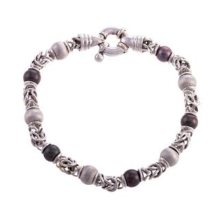An 18K Link Bracelet with Black Pearls