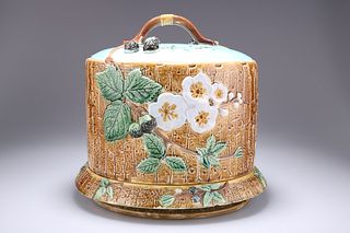 JOSEPH HOLDCROFT
 A MAJOLICA CHEESE DOME AND UNDERPLATE, CI