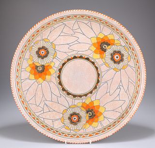 A LARGE CROWN DUCAL POTTERY CHARGER, DESIGNED BY CHARLOTTE 