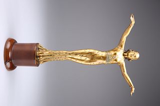 AN EARLY 20TH CENTURY GILT-METAL FIGURE OF A DANCER, IN THE