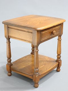 AN ERCOL GOLDEN DAWN SIDE TABLE fitted with a drawer. 47.5c