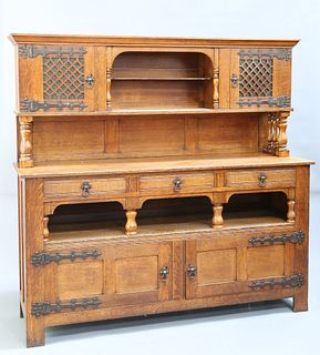 AN ARTS AND CRAFTS OAK SIDEBOARD, IN THE MANNER OF LIBERTY 
