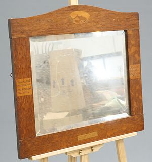 AN ARTS AND CRAFTS OAK MOTTO MIRROR, CIRCA 1900, the arched