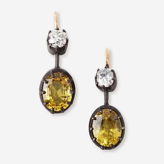 A pair of citrine, diamond, silver, and fourteen karat gold earrings,