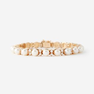 A cultured pearl, diamond, and fourteen karat gold bracelet,