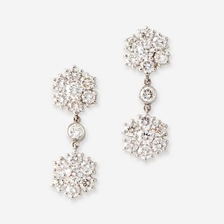 A pair of diamond and platinum earrings,
