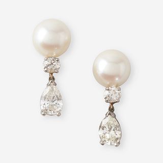 A pair of cultured pearl, diamond, and fourteen karat white gold earrings,
