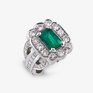 An emerald, diamond, and platinum ring,