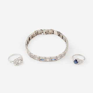 A collection of white gold, platinum, diamond, and sapphire jewelry,