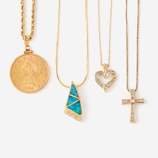 A collection of four gold necklaces,