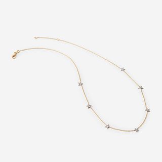 A two-tone eighteen karat gold and diamond necklace,