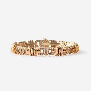 An eighteen karat gold and diamond bracelet,