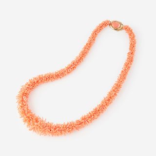 A coral and fourteen karat gold necklace,