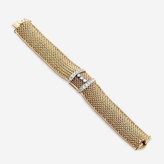 A fourteen karat gold and diamond covered bracelet wristwatch,