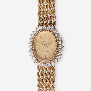 A fourteen karat gold and diamond, bracelet wristwatch,