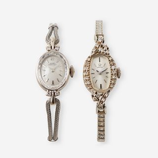 A collection of two fourteen karat white gold and diamond wristwatches, Omega & Girard Perregaux,