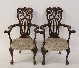 An Antique Pair Of Finely Carved Arm Chairs.