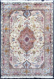 A Persian Tabriz silk & wool rug