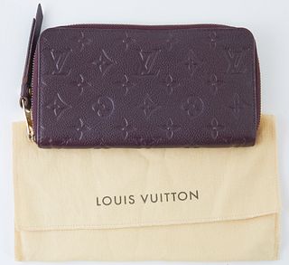 Louis Vuitton Dark Purple Monogram Empreinte Secret Wallet, the calf leather with golden accent zipper to leather pull, opening to two bill compartmen
