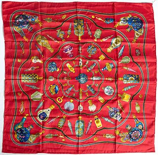 Hermes Qu' Importe Le Flacon Silk Scarf, first issued in1986, with the 'Le Flacon' motif and red background, with hand rolled edges, H.- 36 in., W.- 3