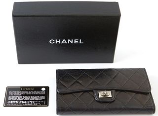 Chanel Reissue Bifold Black Wallet, c. 2006-2008, the calf leather quilted with brushed silver accents, opening to four bill compartments, one coin po