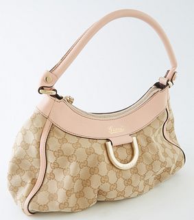 Gucci Powder Pink Leather and Beige Monogramed Canvas PM D-Ring Hobo Handbag, the exterior with gold hardware, opening to a brown interior with side z