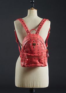 MCM Pink Coated Canvas Studs Star Backpack, with gold and gun metal hardware, the interior of the bag lined in red monogram satin, with a back sip clo