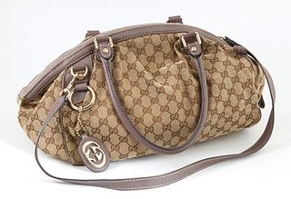 Gucci Beige Monogrammed Canvas and Lilac Smooth Calf Leather Sukey Boston Shoulder Bag, the exterior with an attached logo charm, with an adjustable s