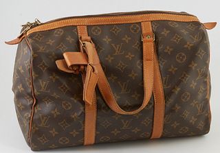 Louis Vuitton Brown Monogram Coated Canvas 35 Sac Souple Travel Bag, the vachetta leather straps with brass hardware and leather luggage tag, opening 