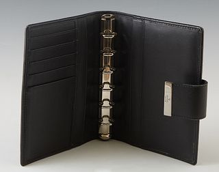 Gucci GG Black Canvas Agenda Wallet, with gun metal hardware and a snap closure, the interior linked in black leather with numerous card holders and f