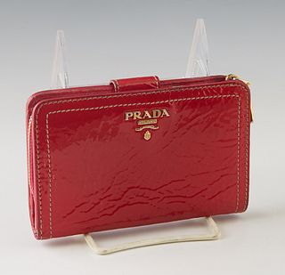 Prada Raspberry Patent Leather Wallet, with gold hardware and snap buckle closure, the interior lined in hot pink leather with numerous card slots and