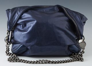 Gucci Metallic Navy Leather Shoulder Bag, with gun metal accents, the top zipper with a leather pull, opening to a large Gucci logo black lined interi