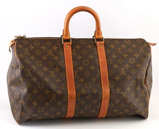 Louis Vuitton Brown Monogram Coated Canvas 45 Keepall Travel Bag, the vachetta leather straps with golden brass hardware, opening to a brown interior,