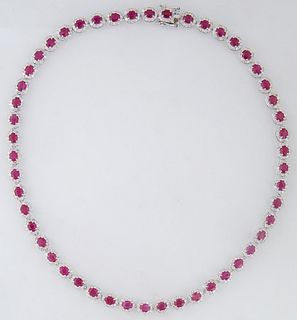 Platinum Link Necklace, each of the 50 oval links with a central oval ruby atop a border of tiny round diamonds, total ruby wt.- 19.13 cts., total dia