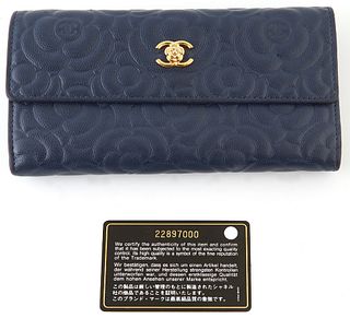 Chanel Navy Blue Camellia Embossed Leather Logo Flap Wallet, c.2016-2017, the calf leather with a golden brass Coco Chanel logo combined with a camell