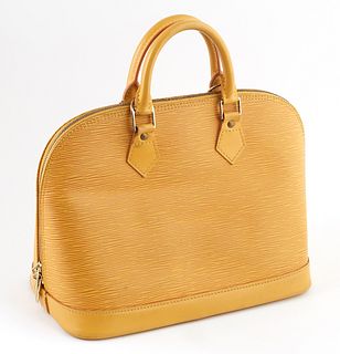 Louis Vuitton Yellow Epi Leather PM Alma Handbag, with golden brass hardware, opening to a purple suede interior with small pocket, H.- 9 in., W.- 12 