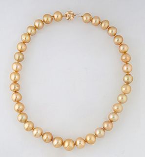 Graduated Strand of Thirty-Five Natural Golden Cultured South Seas Pearls, ranging from 11-15mm, with a 14K white gold ball clasp, L.- 18 in., with ap
